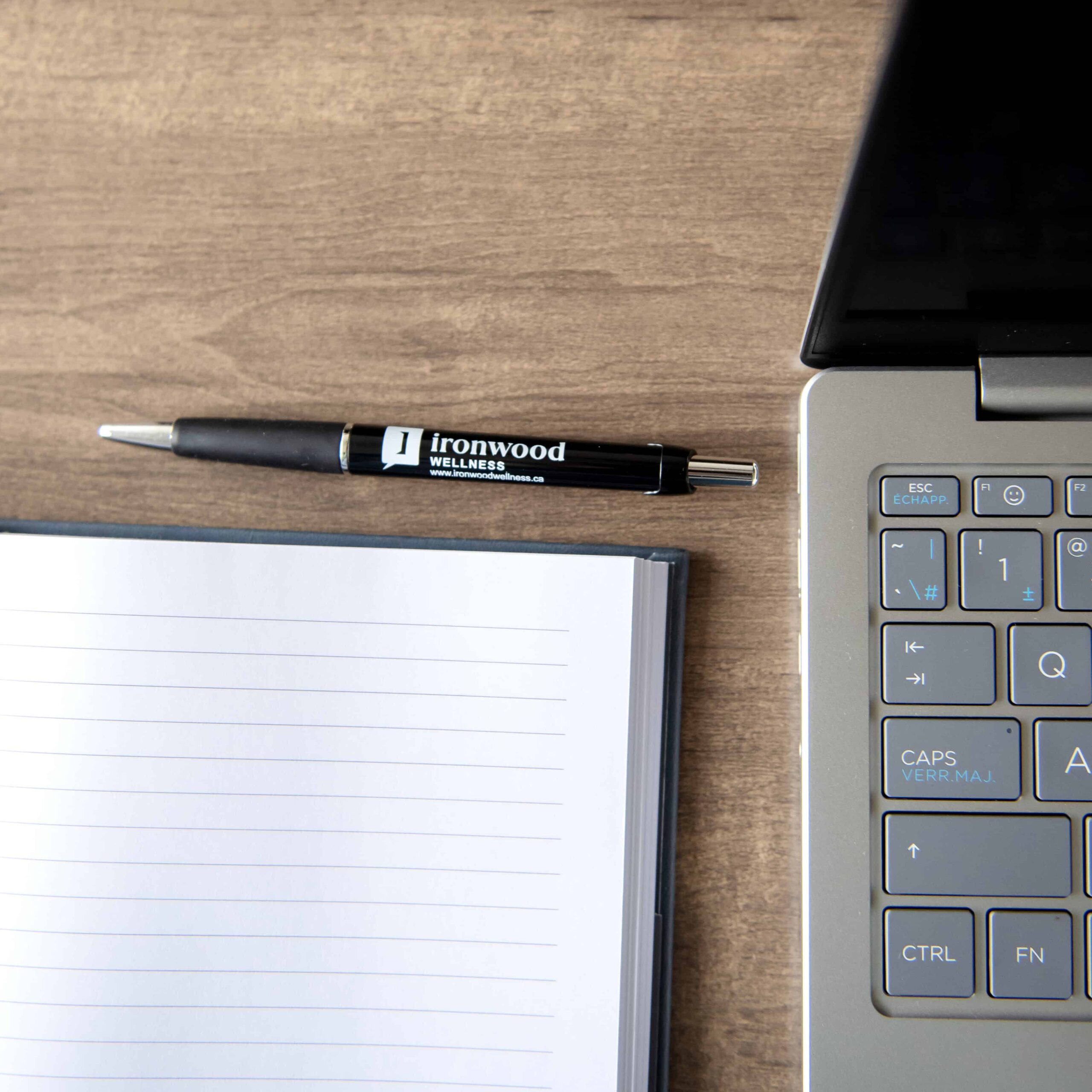 photo of notebook pen laptop